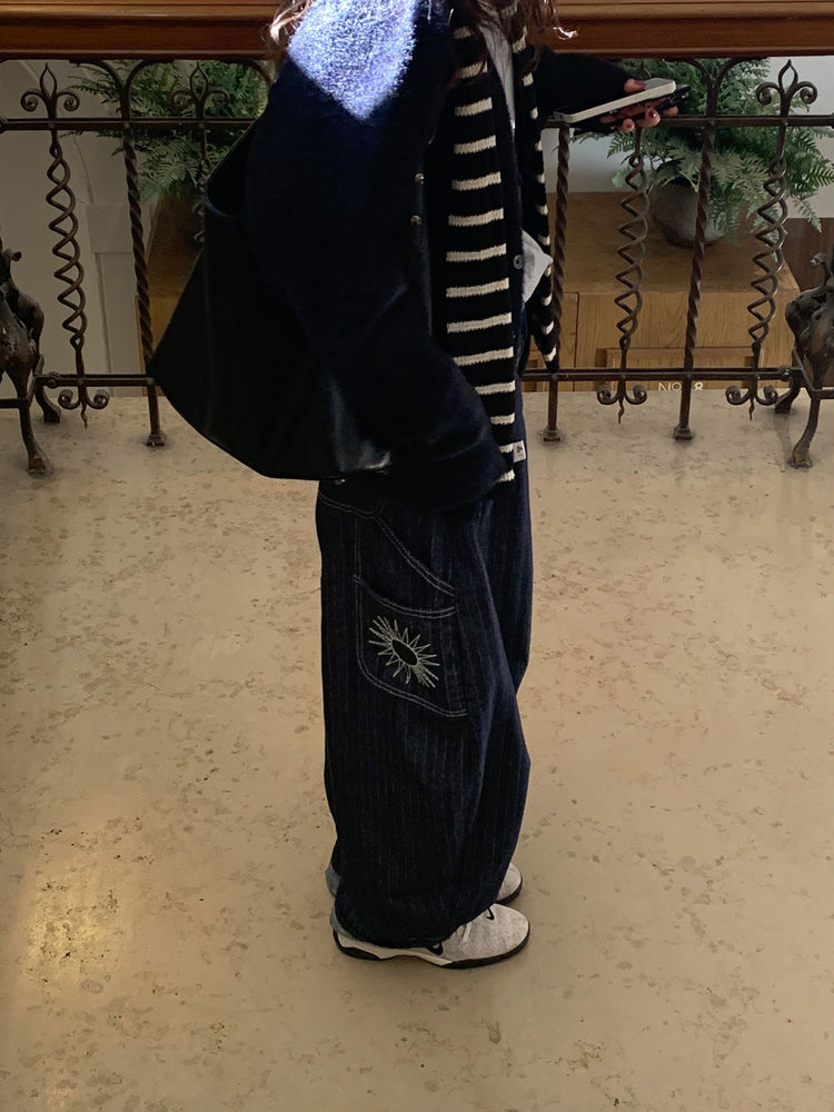 暗紋理太陽圖案廓形牛仔褲