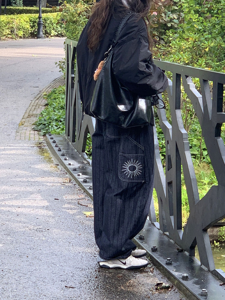 暗紋理太陽圖案廓形牛仔褲