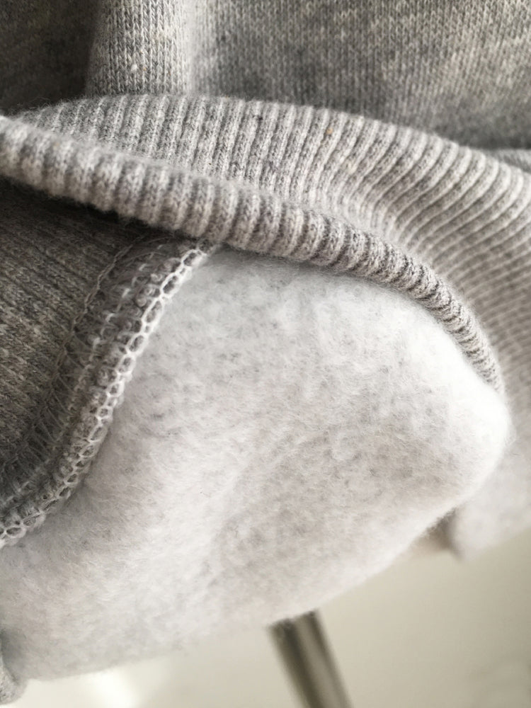 鉚釘圈細節假兩件美肩上衣